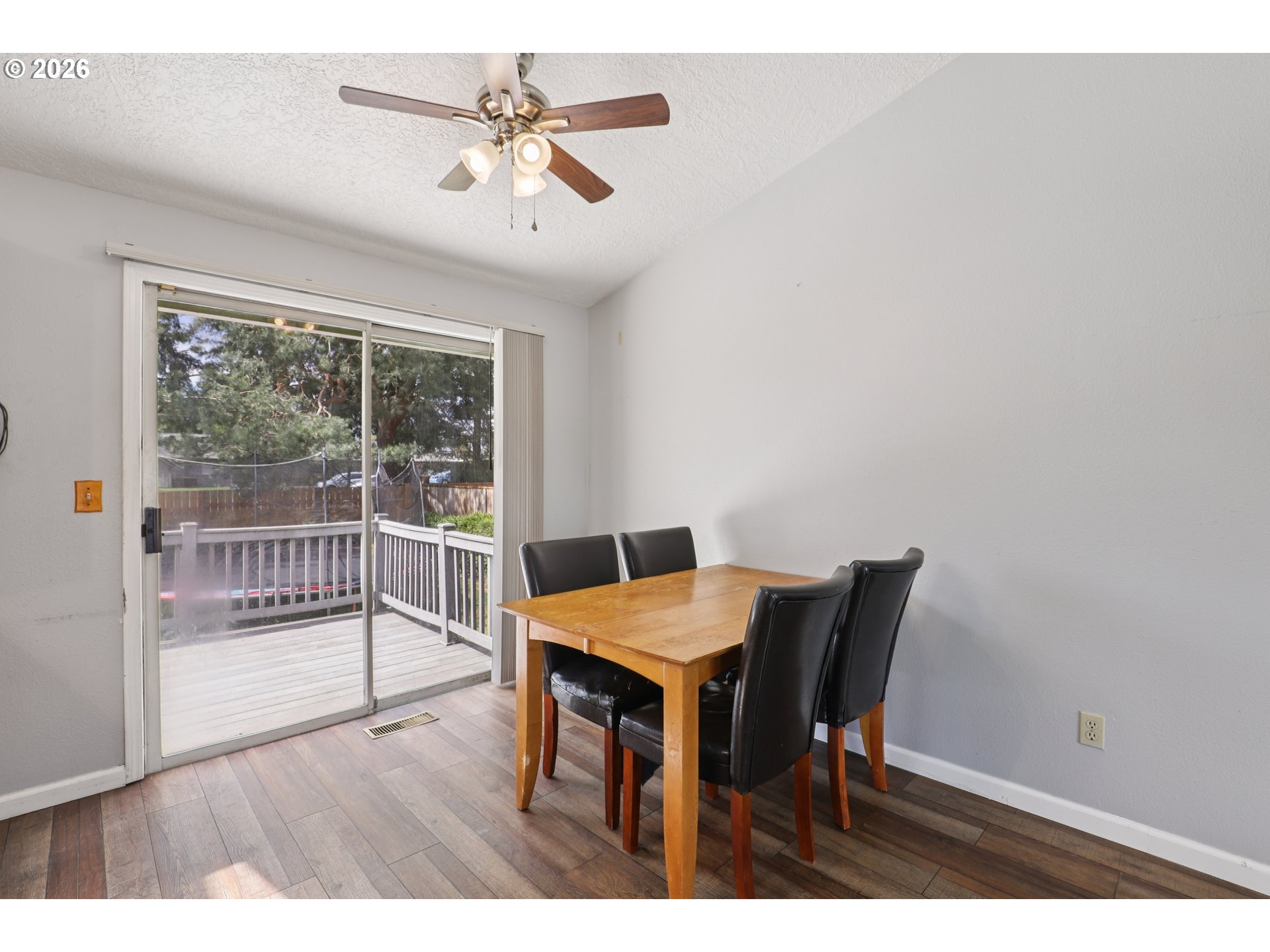 691 Southwest Linneman Court Gresham, OR 97030 - Photo 8 of 35 a view of a dining room with furniture window and wooden floor