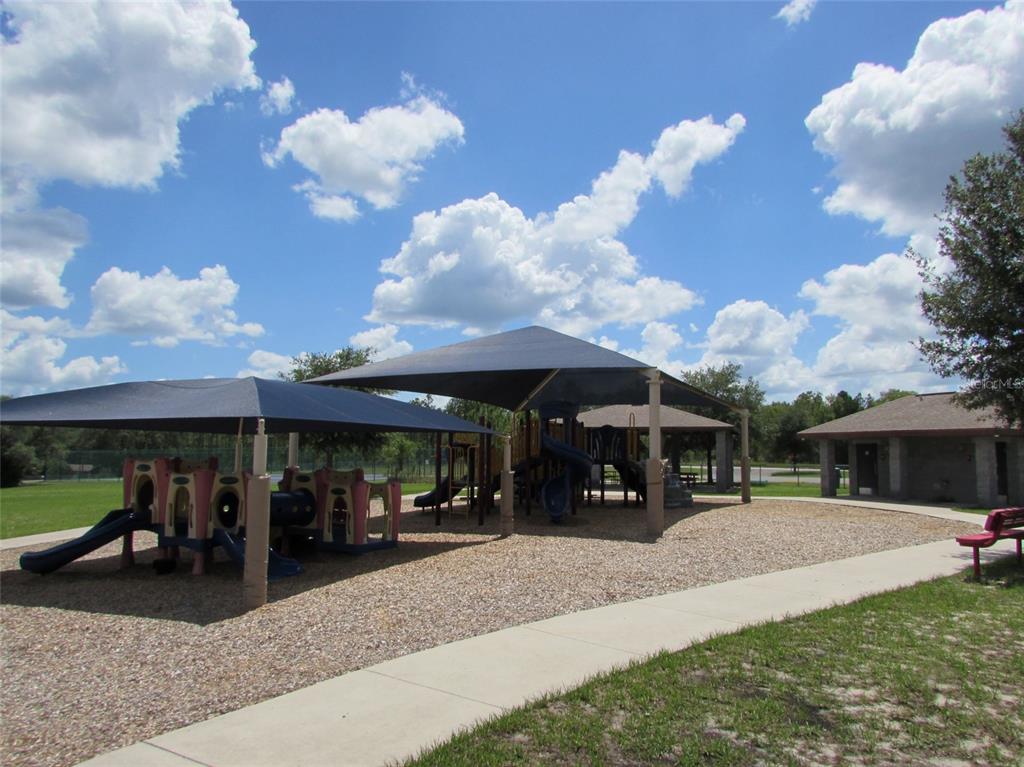 0 Southwest Big Bear Ridge Dunnellon, FL 34431 - Photo 14 of 19 a view of a patio with table and chairs under an umbrella
