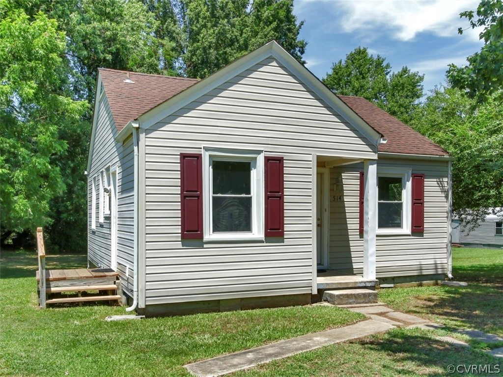 514 Riverview Road Colonial Heights, VA 23834 - Photo 17 of 17 a view of a house with a yard and a garden