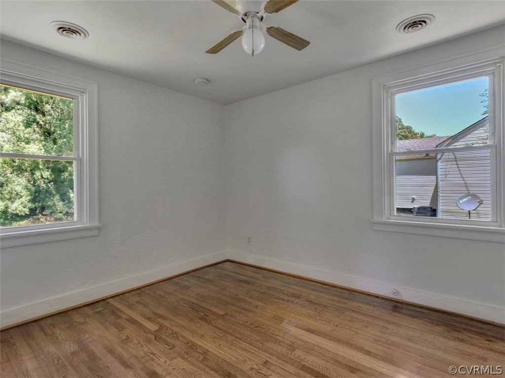 514 Riverview Road Colonial Heights, VA 23834 - Photo 8 of 17 wooden floor in an empty room with a window