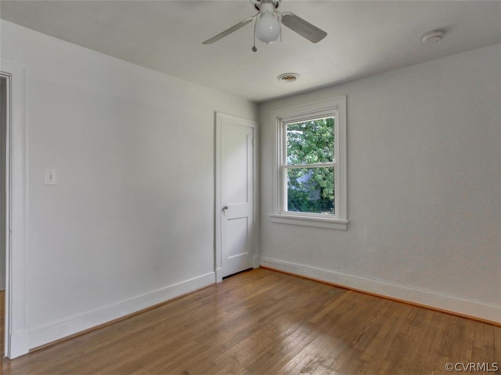 514 Riverview Road Colonial Heights, VA 23834 - Photo 9 of 17 a view of an empty room with wooden floor and a window