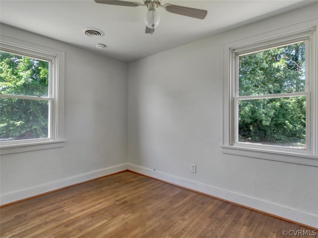514 Riverview Road Colonial Heights, VA 23834 - Photo 10 of 17 a view of empty room with wooden floor and fan