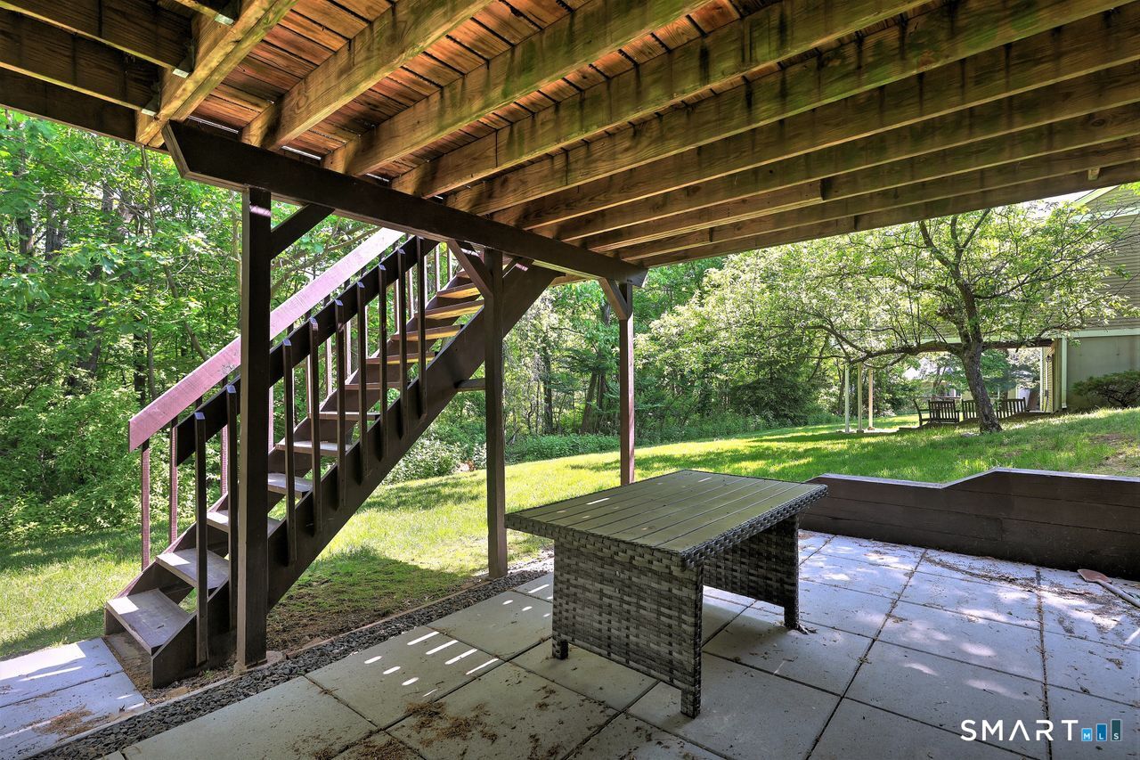 9 Canterbury Road, Unit 9 Hamden, CT 06514 - Photo 28 of 29 a view of swimming pool with garden and patio