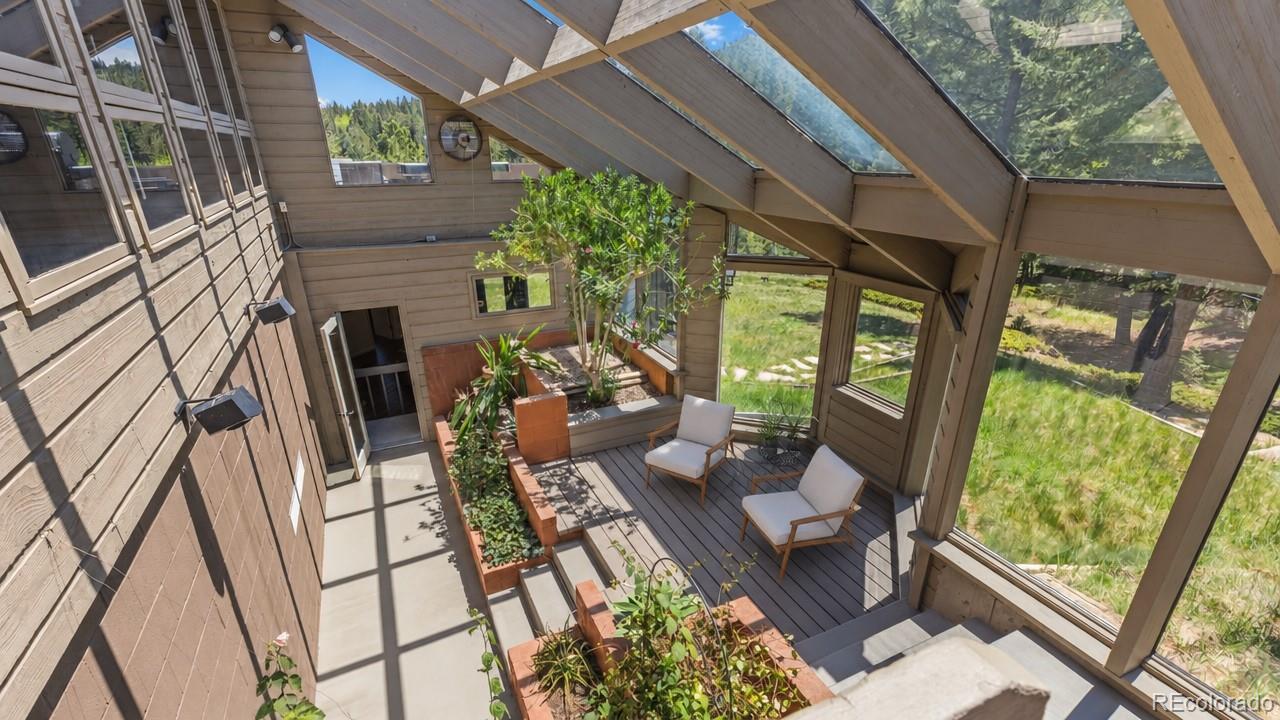 1323 South Snyder Gulch Road Evergreen, CO 80439 - Photo 25 of 47 a view of yard from deck with patio