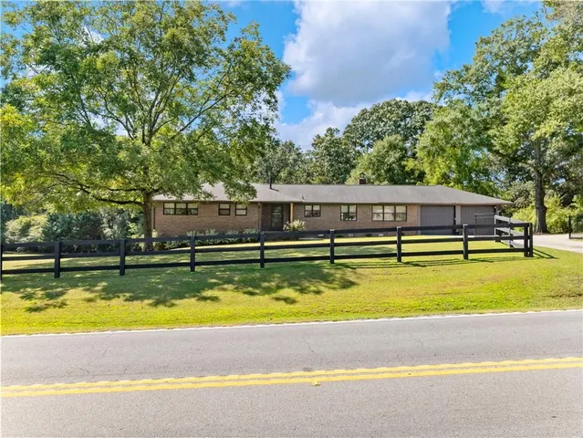 a view of swimming pool with trees