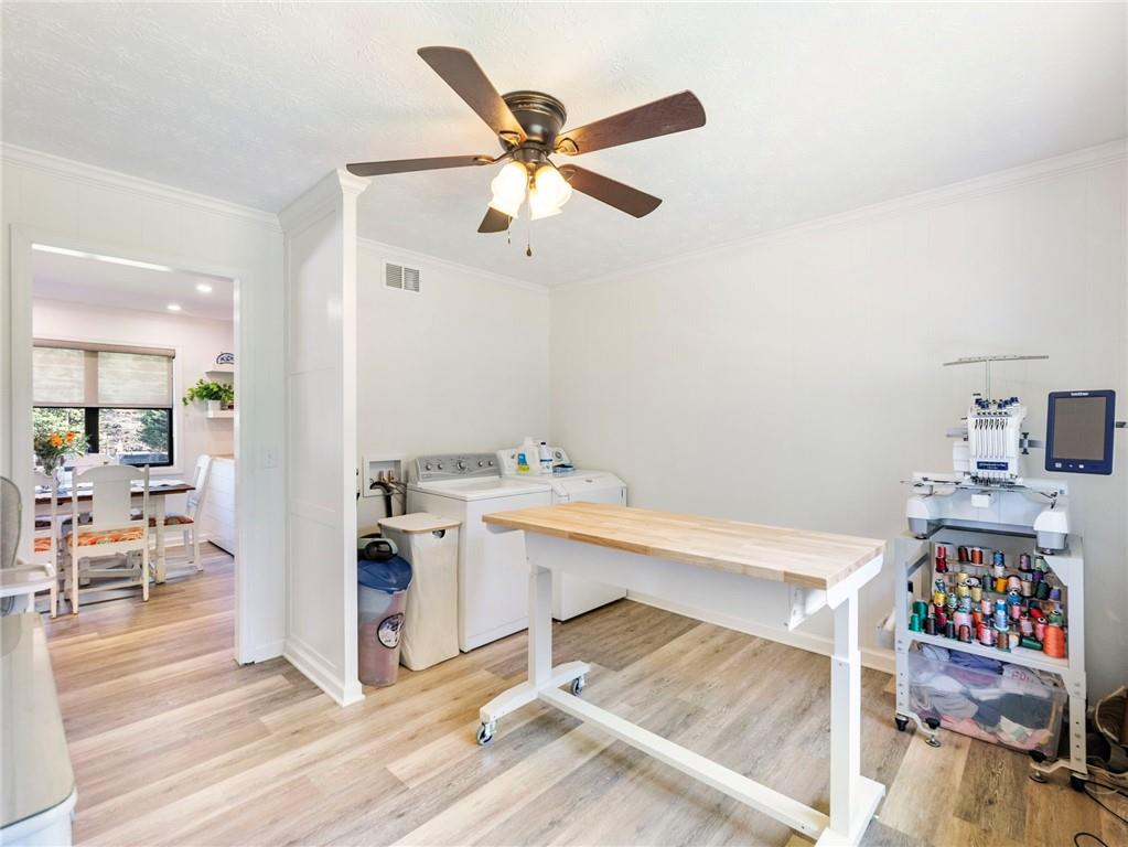 3125 Bart Johnson Road Buford, GA 30519 - Photo 27 of 50 a view of kitchen and utility room with wooden floor