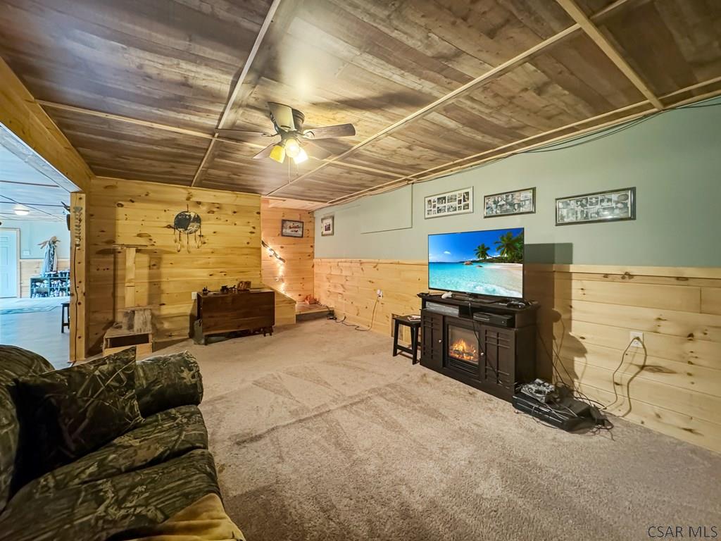 219 Wild Cat Road Windber, PA 15963 - Photo 50 of 63 a living room with furniture and a flat screen tv
