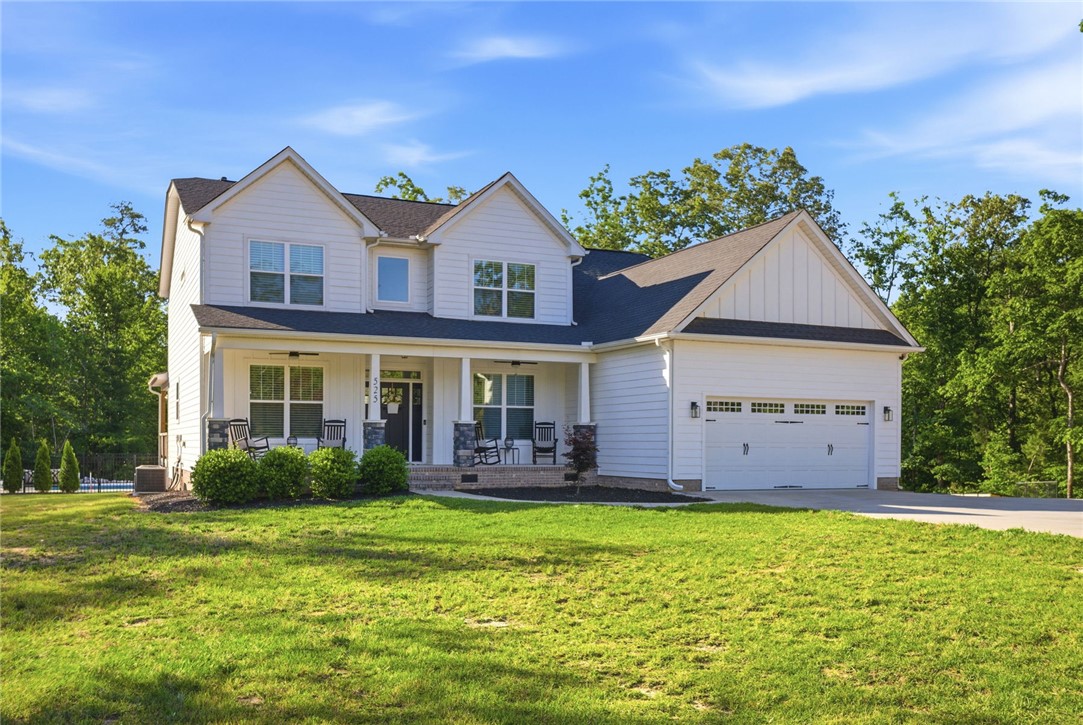 525 16th Circle Walhalla, SC 29691 - Photo 9 of 50 This charming residence features a welcoming front porch, a pristine lawn, and a spacious attached garage.