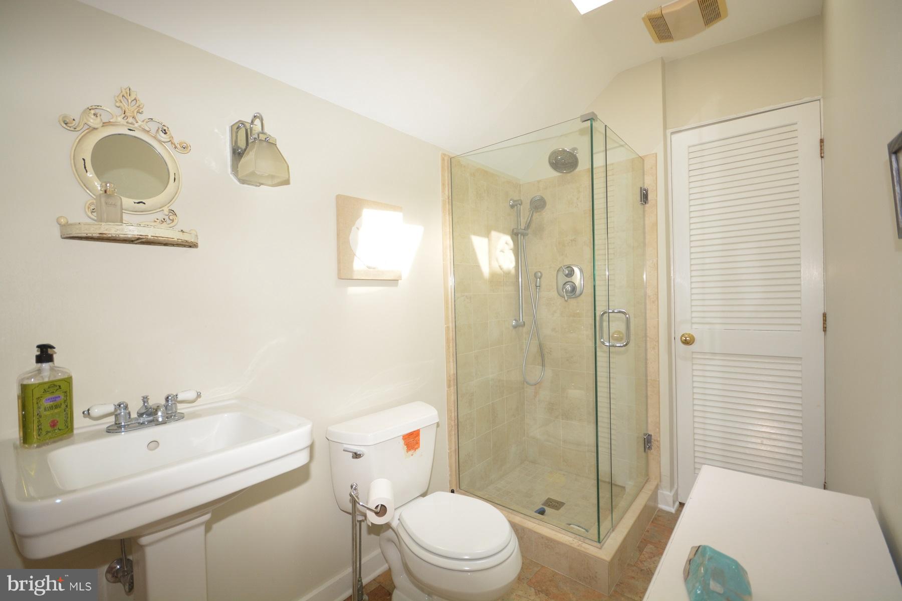 7967 Quaker Neck Road Bozman, MD 21612 - Photo 11 of 21 a bathroom with a sink toilet and shower