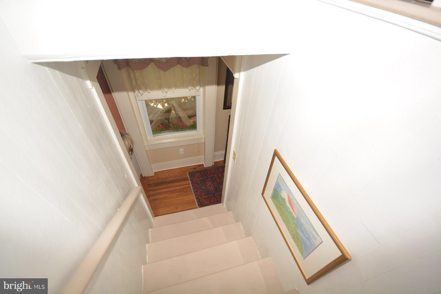7967 Quaker Neck Road Bozman, MD 21612 - Photo 15 of 21 a view of staircase with white walls and a potted plant