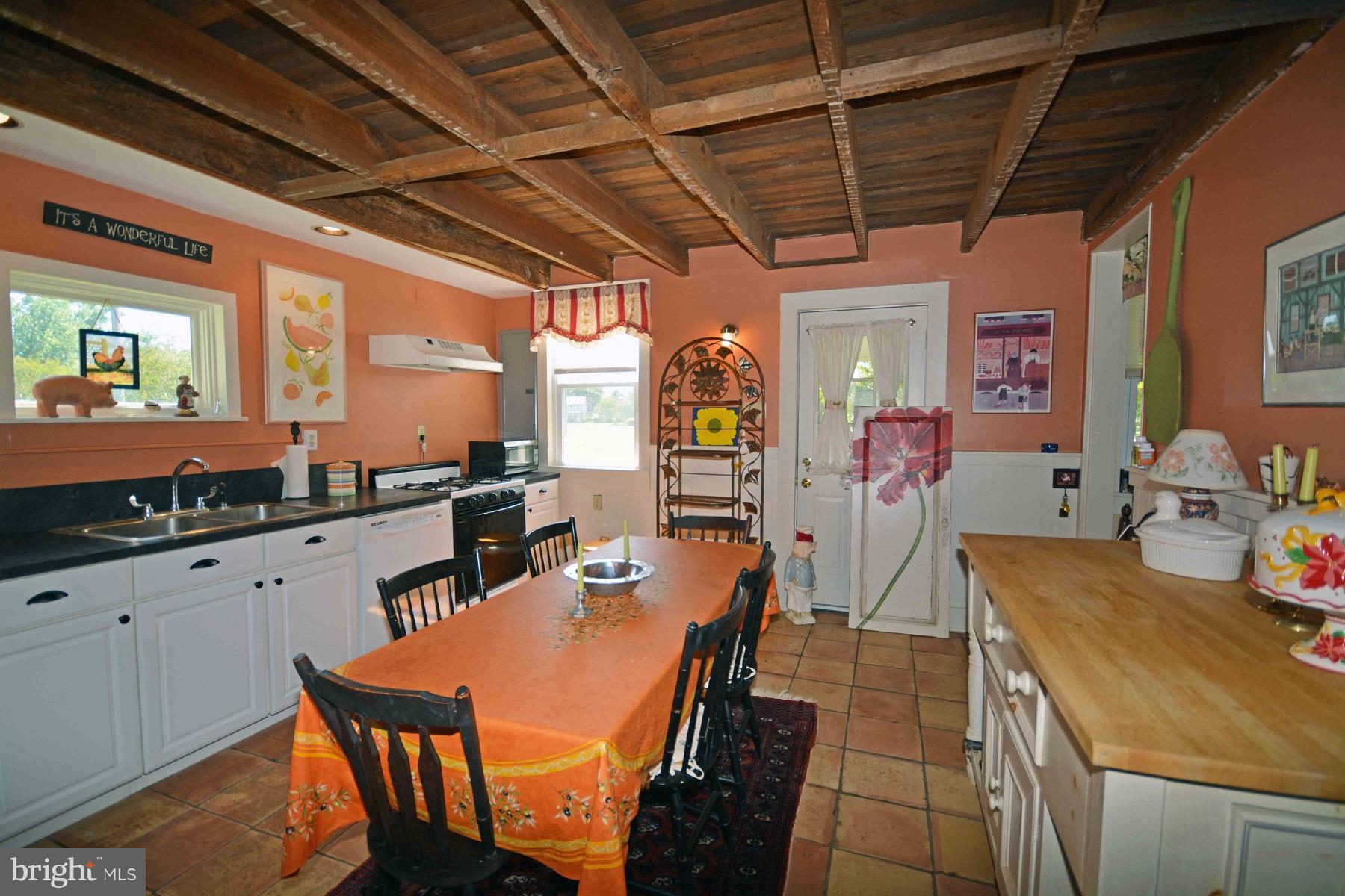 7967 Quaker Neck Road Bozman, MD 21612 - Photo 6 of 21 a view of a dining room with furniture