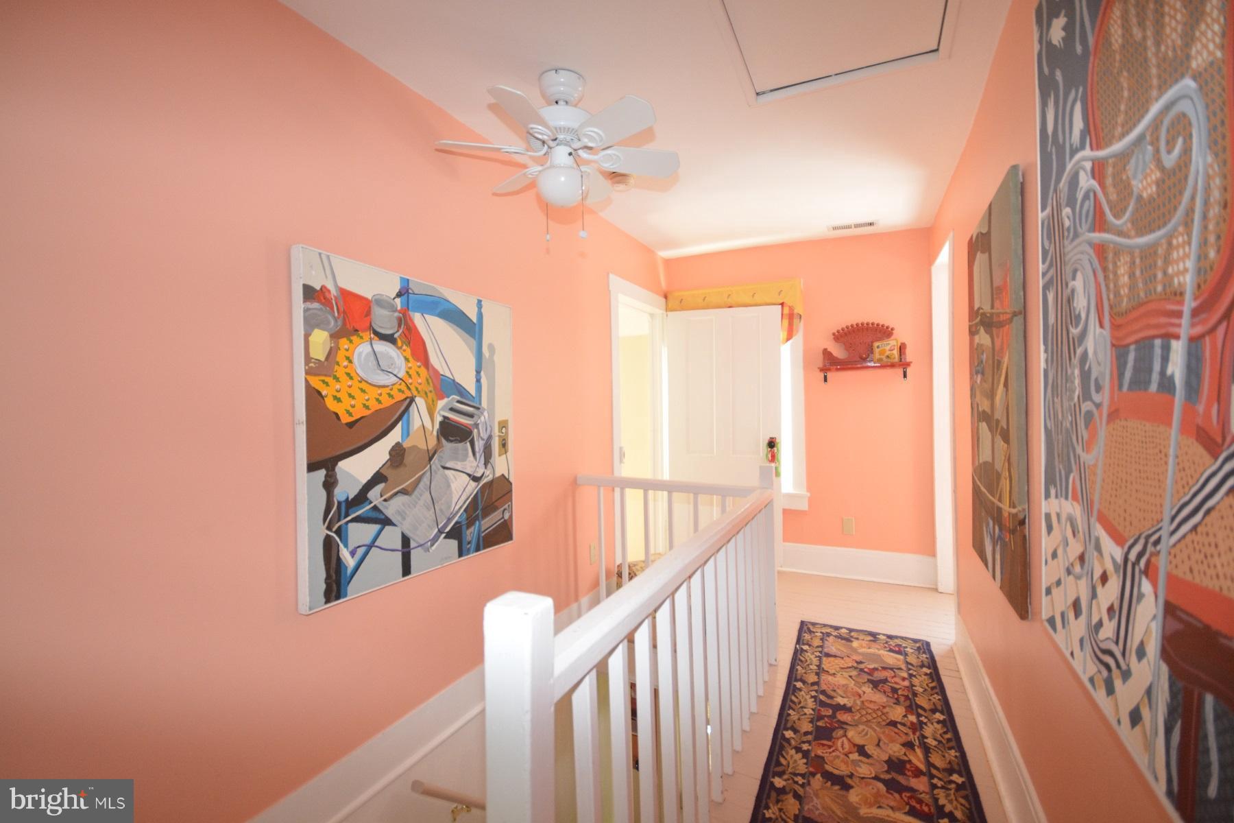 7967 Quaker Neck Road Bozman, MD 21612 - Photo 10 of 21 a view of a hallway with wooden floor and stairs