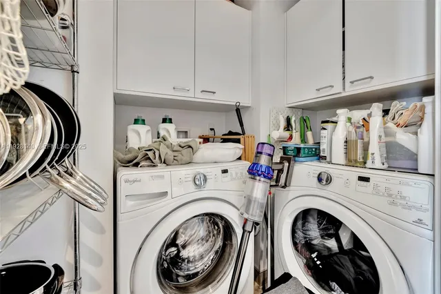 a bathroom with a sink mirror vanity and toilet