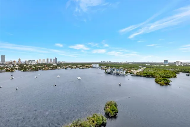 a lobby with furniture and a chandelier