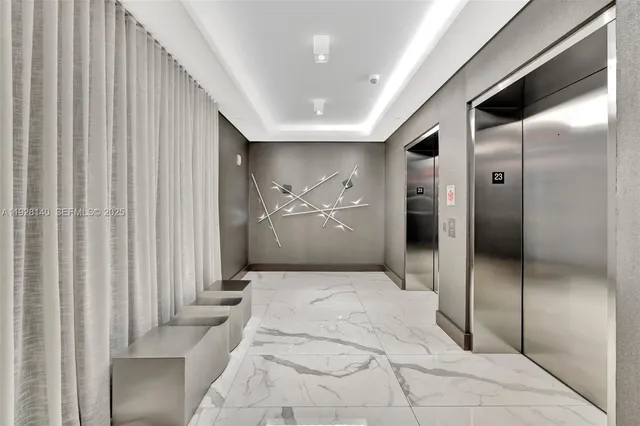 a living room filled with furniture and a book shelf