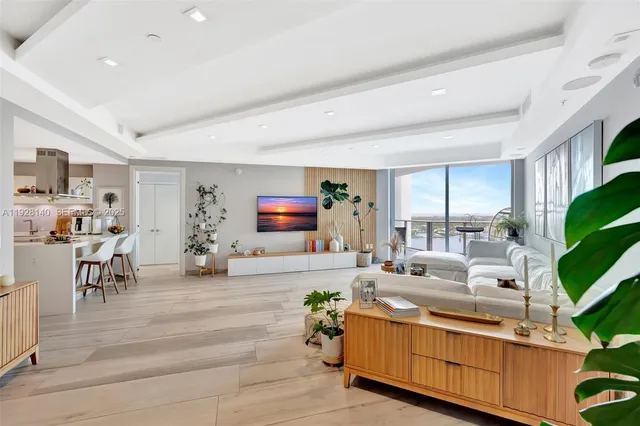 a room with gym equipment and a flat screen tv