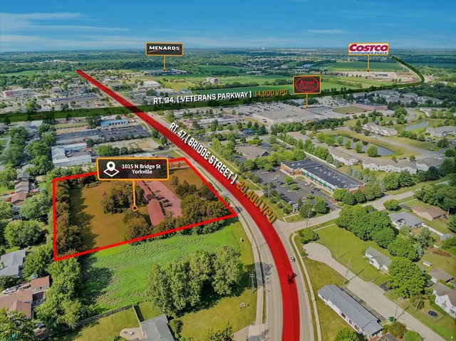 an aerial view of residential building and lake