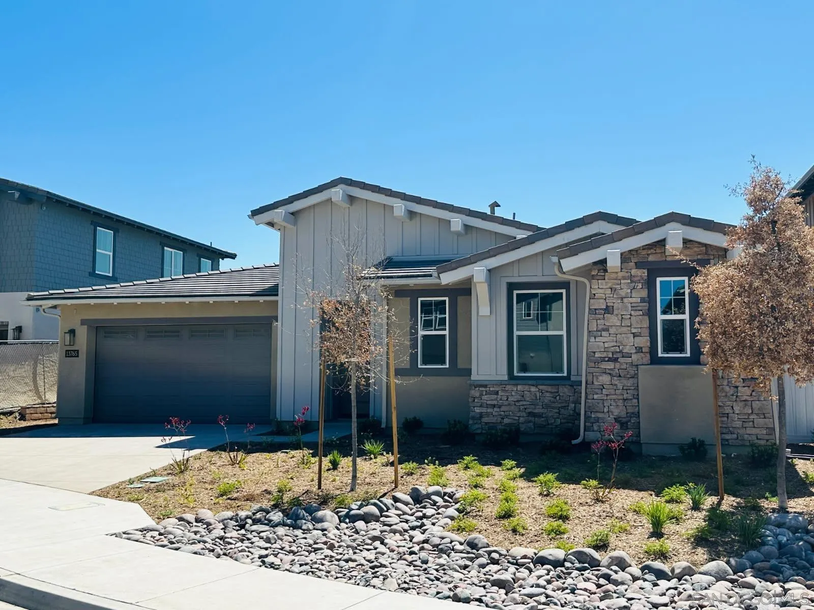 13765 Holly Oak Way Poway, CA 92064 - Photo 1 of 18 a front view of a house with a yard