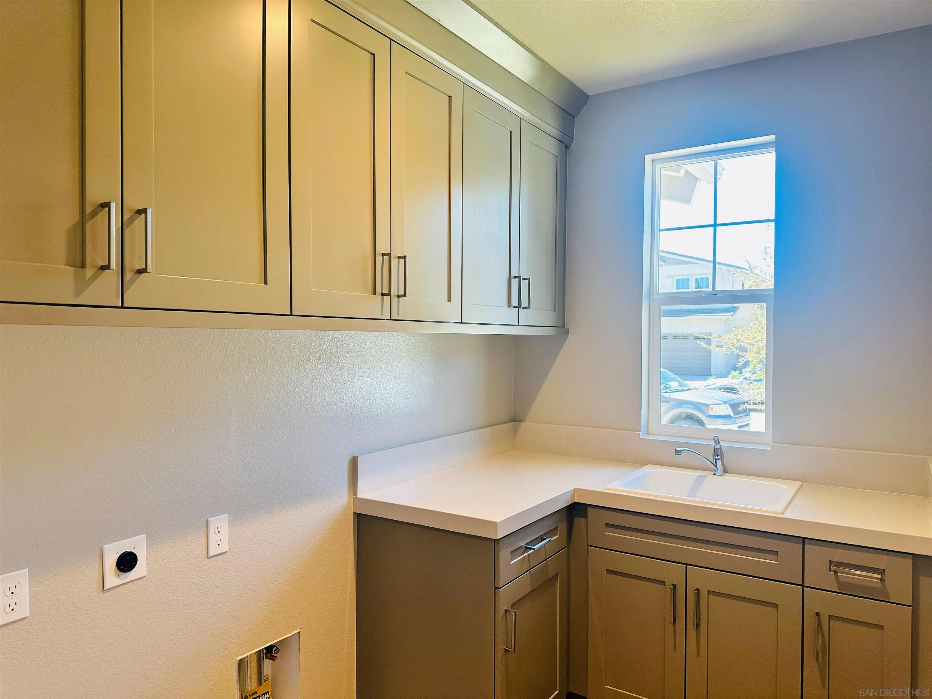 13765 Holly Oak Way Poway, CA 92064 - Photo 16 of 18 a kitchen with a sink cabinets and a window