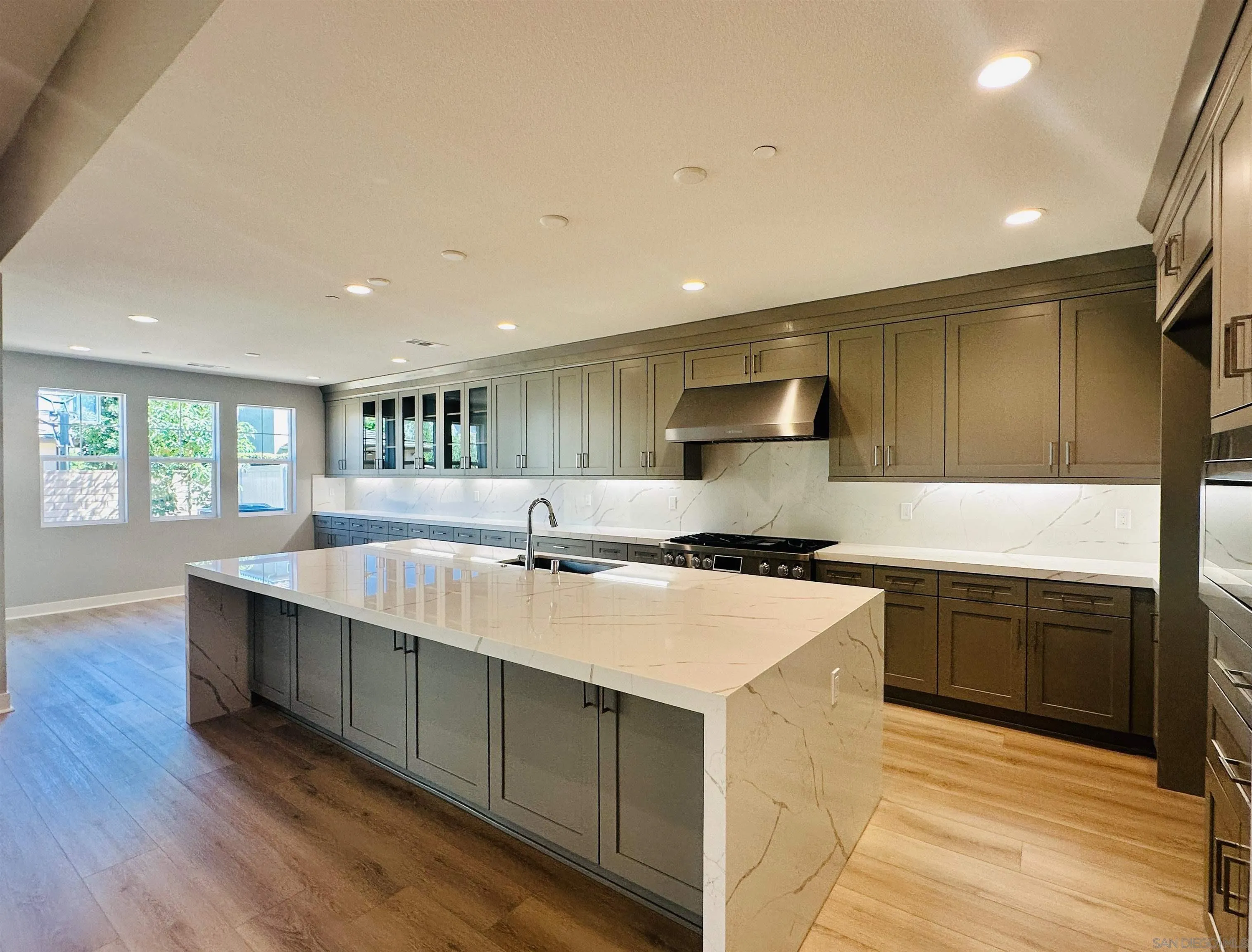 13765 Holly Oak Way Poway, CA 92064 - Photo 2 of 18 a large kitchen with stainless steel appliances granite countertop a sink and a stove