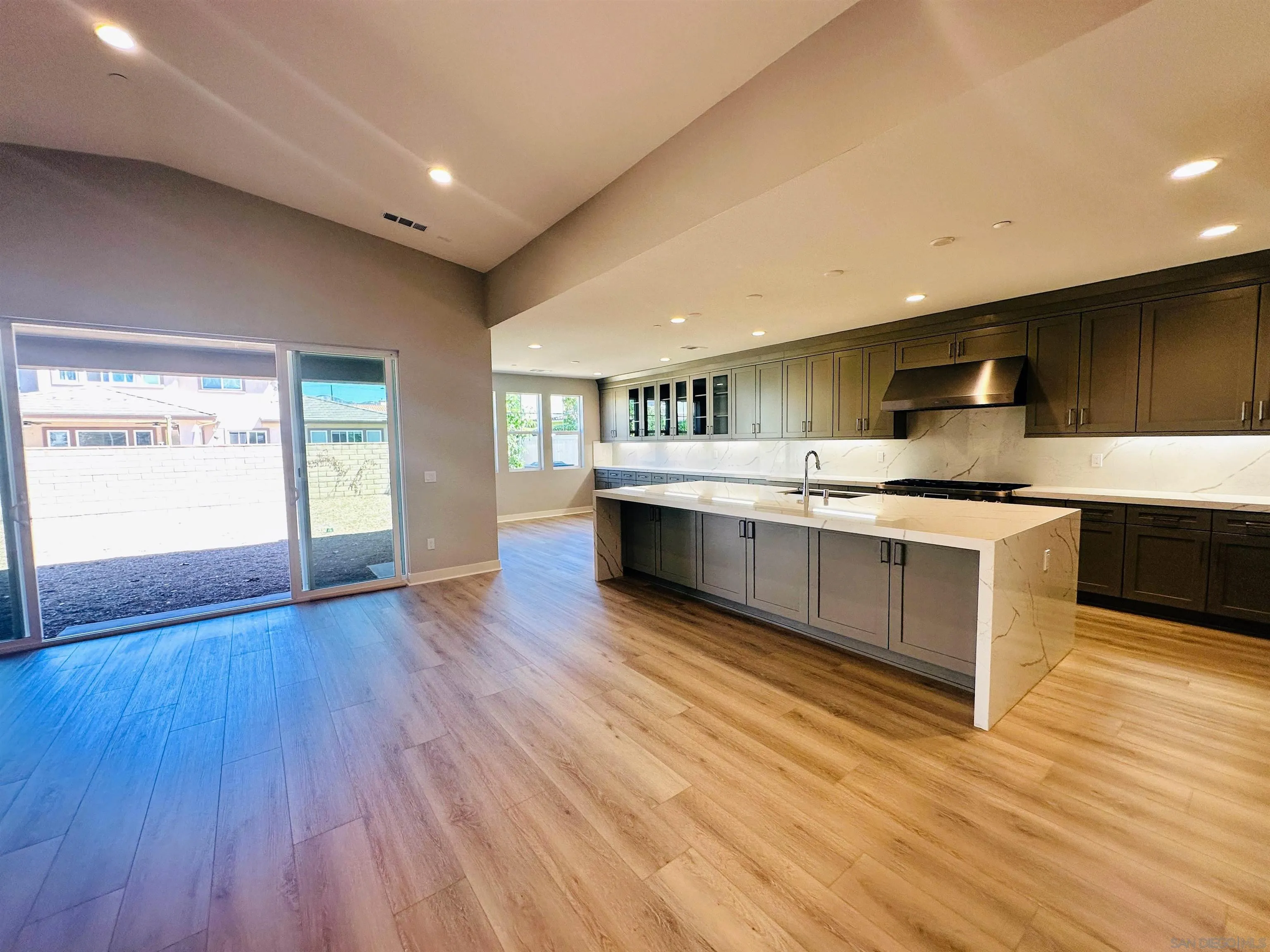 13765 Holly Oak Way Poway, CA 92064 - Photo 4 of 18 a large kitchen with stainless steel appliances granite countertop a large counter top a sink and a stove