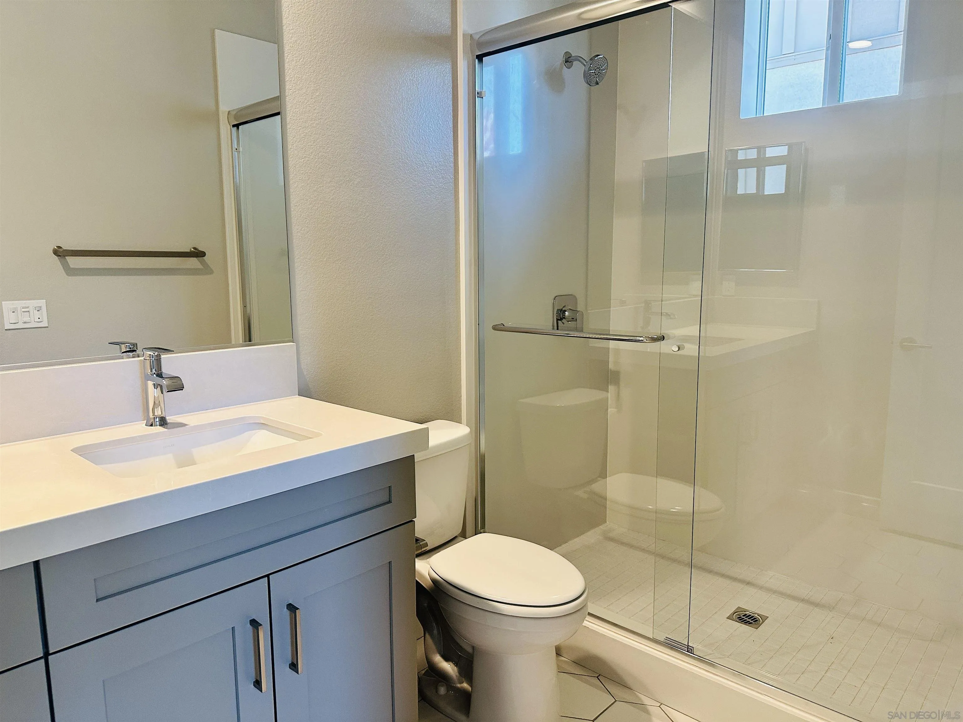 13765 Holly Oak Way Poway, CA 92064 - Photo 10 of 18 a bathroom with a sink toilet and shower