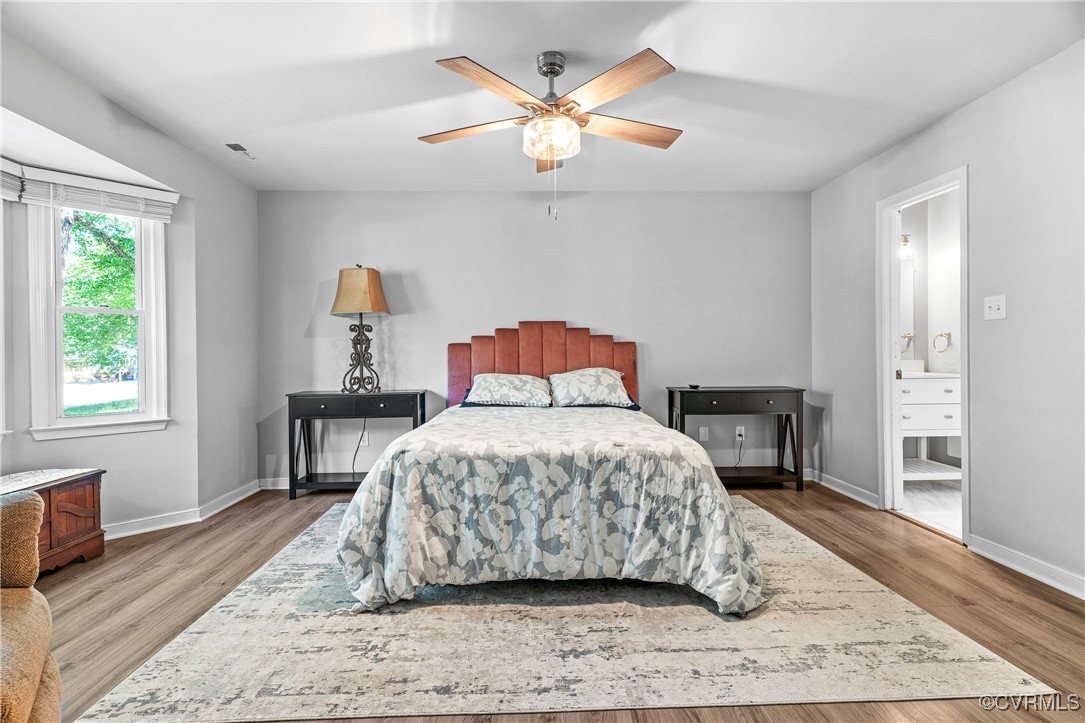 7018 Pointer Ridge Road Midlothian, VA 23112 - Photo 15 of 27 a bedroom with a bed and wooden floor