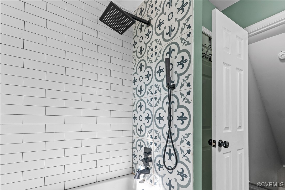 7018 Pointer Ridge Road Midlothian, VA 23112 - Photo 18 of 27 a bathroom with a shower and a bathtub