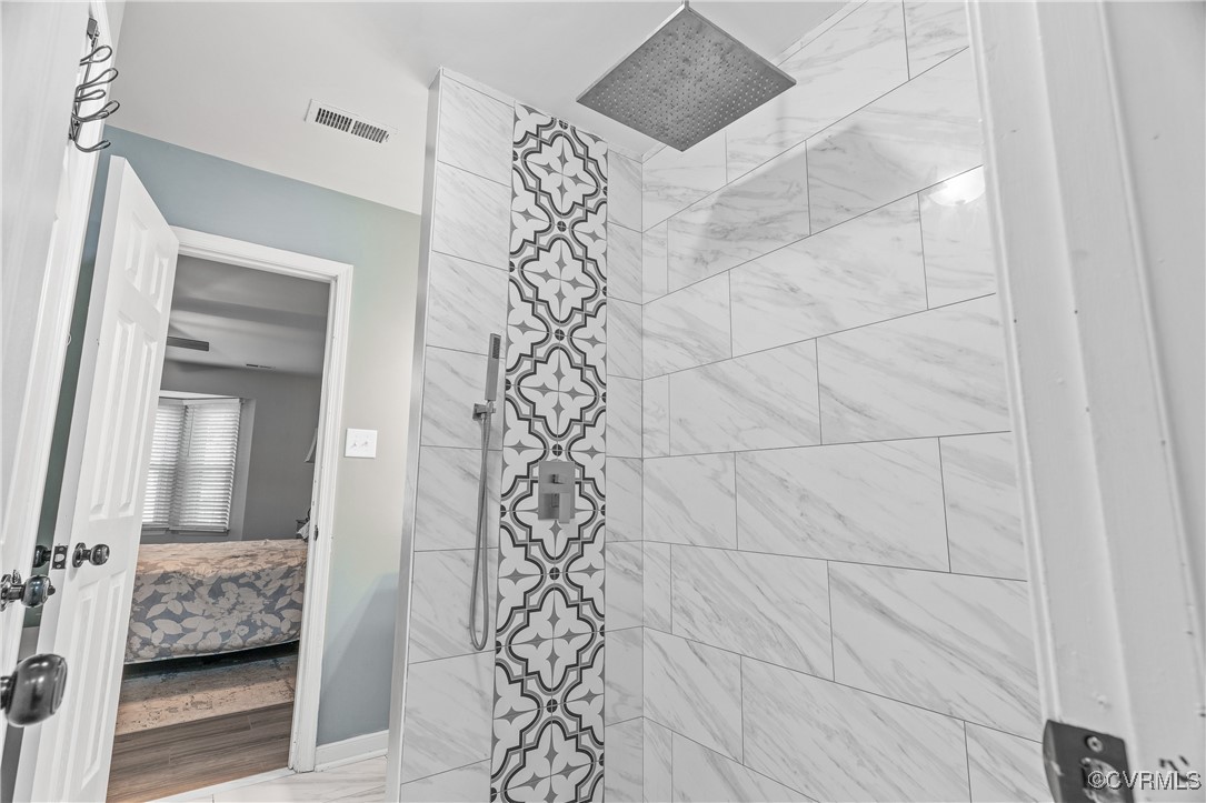 7018 Pointer Ridge Road Midlothian, VA 23112 - Photo 21 of 27 a bathroom with a bathtub and shower