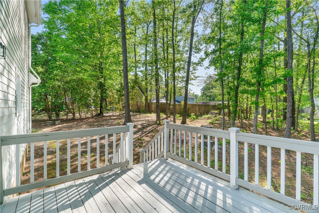 7018 Pointer Ridge Road Midlothian, VA 23112 - Photo 24 of 27 a view of a wooden deck next to a yard