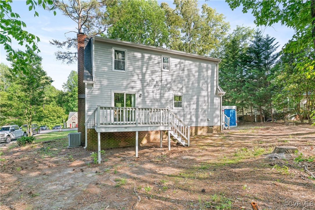 7018 Pointer Ridge Road Midlothian, VA 23112 - Photo 27 of 27 a backyard of a house with table and chairs