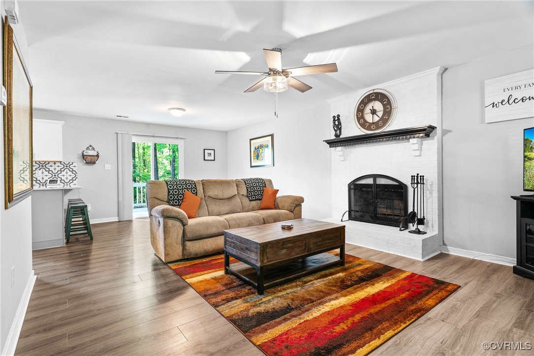 7018 Pointer Ridge Road Midlothian, VA 23112 - Photo 5 of 27 a living room with furniture and a fireplace
