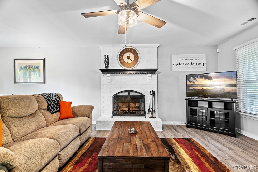 7018 Pointer Ridge Road Midlothian, VA 23112 - Photo 7 of 27 a living room with furniture and a fireplace
