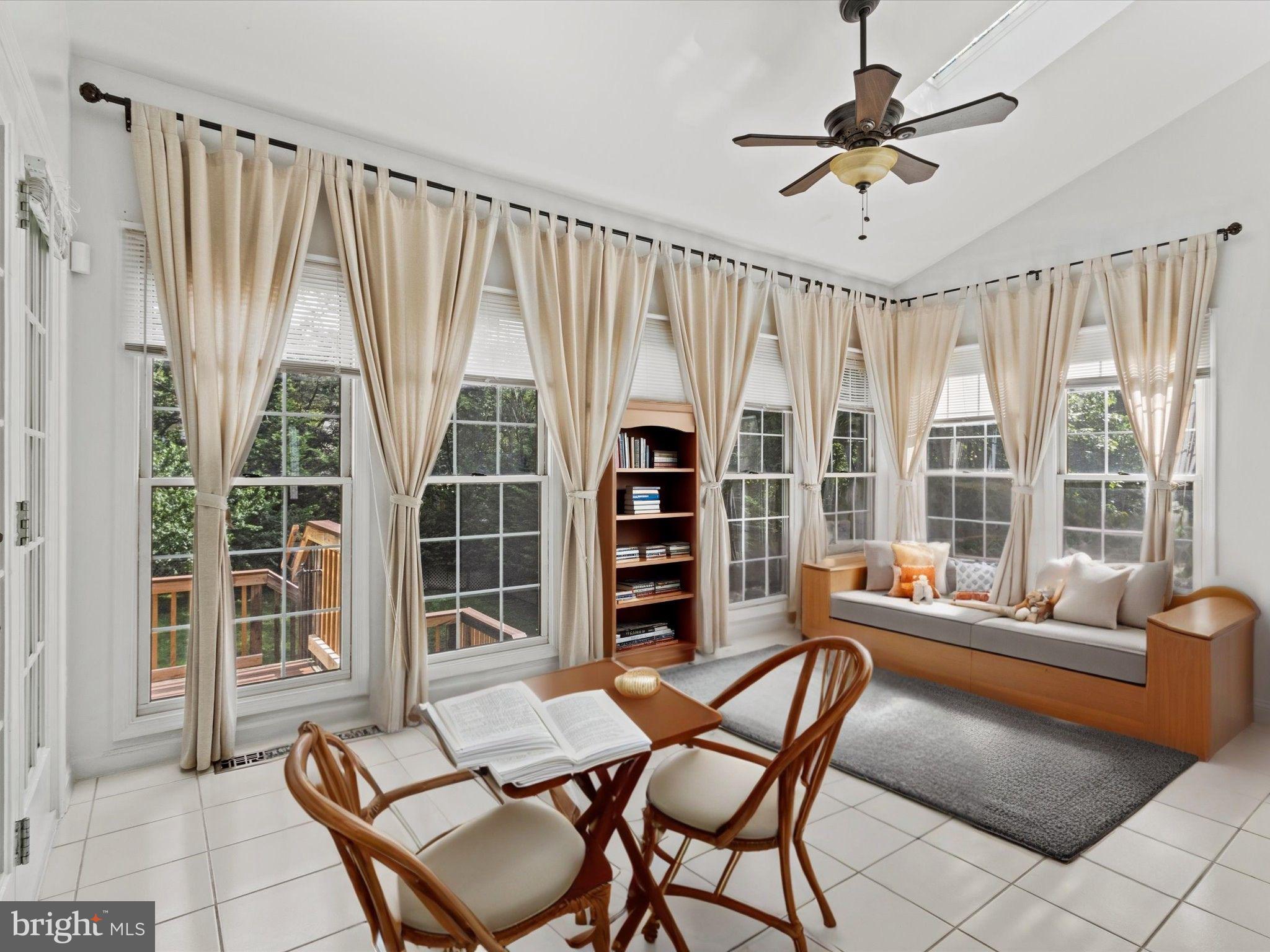1505 Ridge Forest Way Hanover, MD 21076 - Photo 11 of 40 a dining room with furniture and a large window