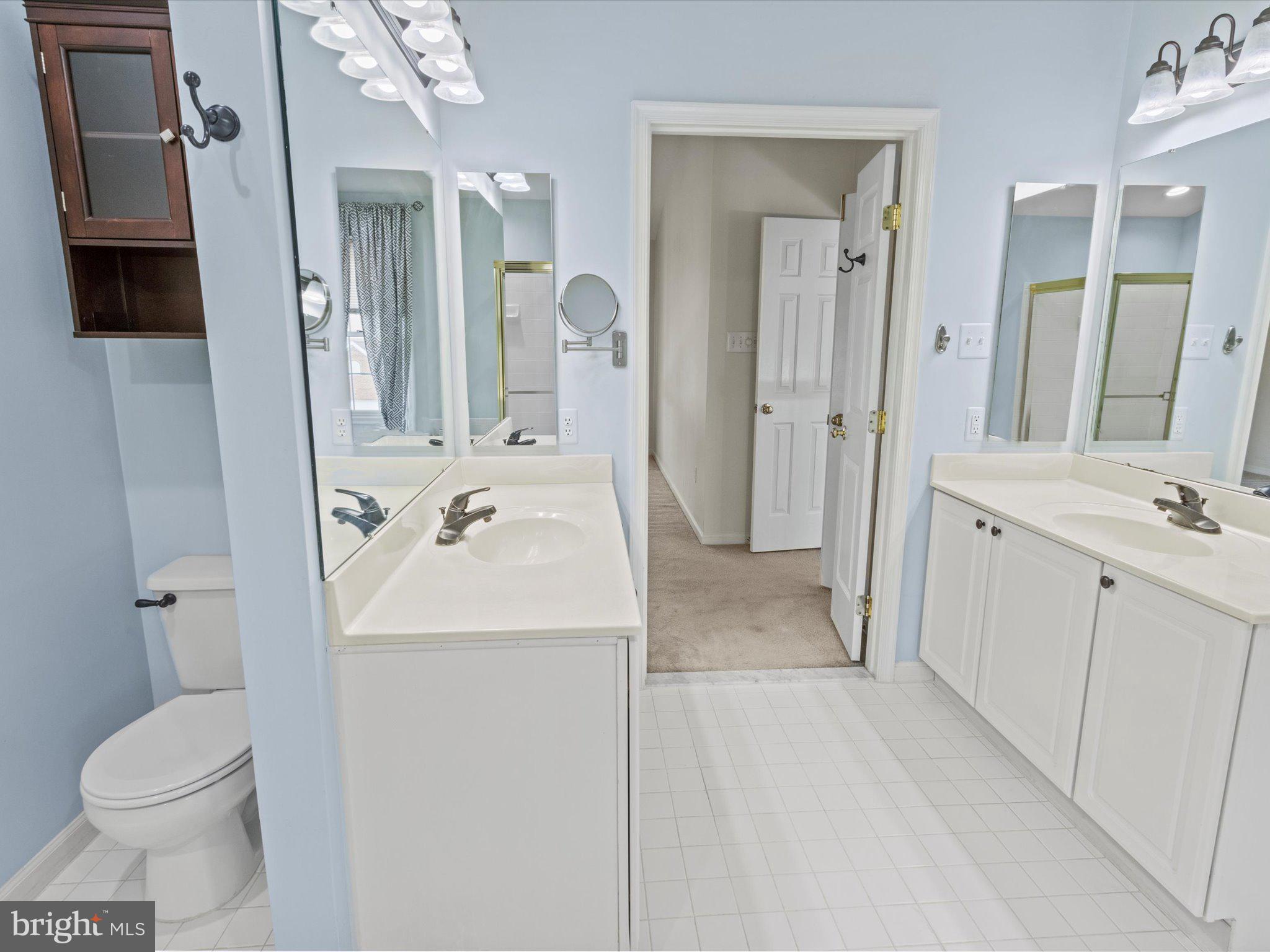 1505 Ridge Forest Way Hanover, MD 21076 - Photo 19 of 40 a bathroom with a sink toilet and shower