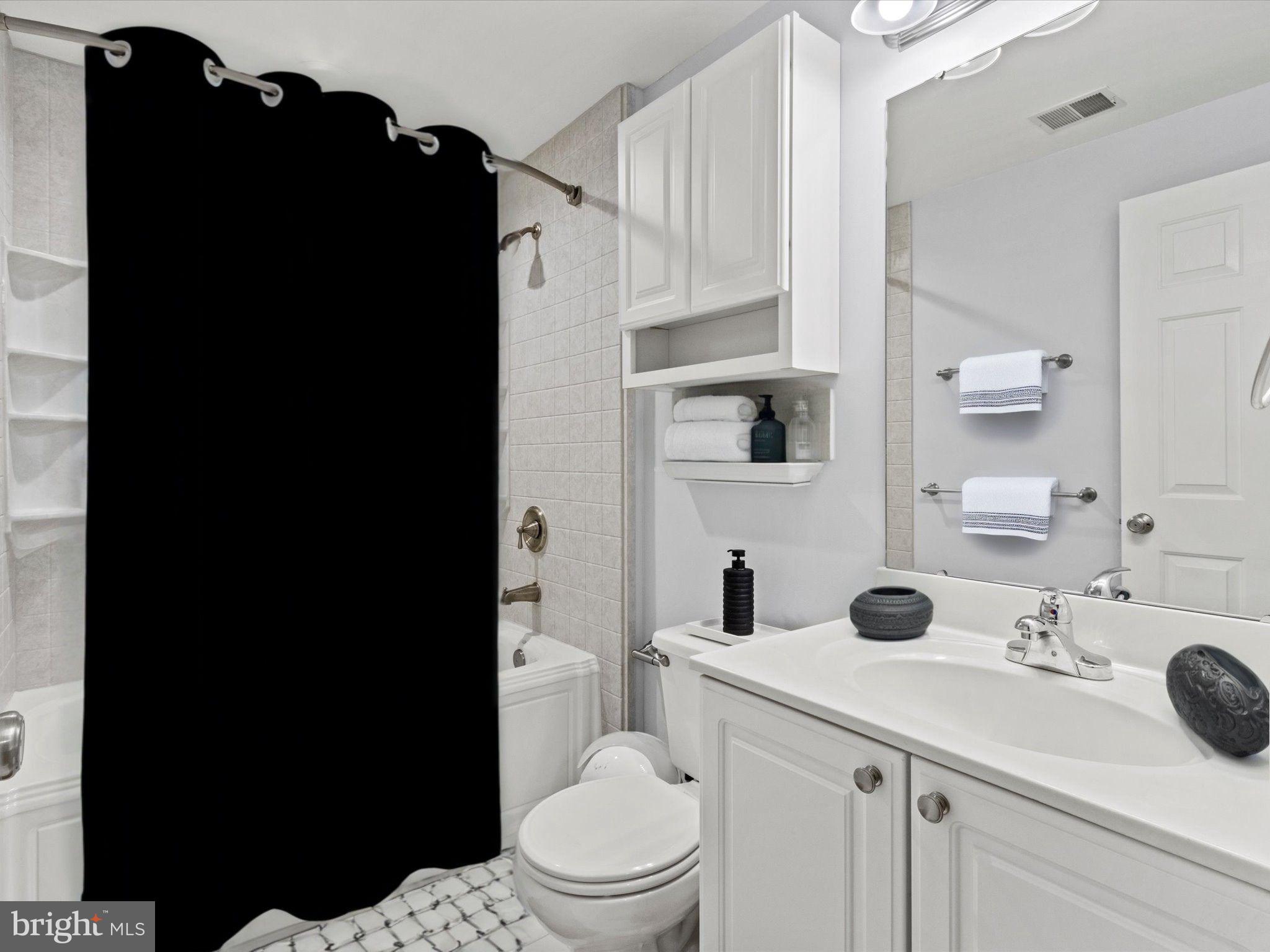 1505 Ridge Forest Way Hanover, MD 21076 - Photo 23 of 40 a bathroom with a sink toilet and shower