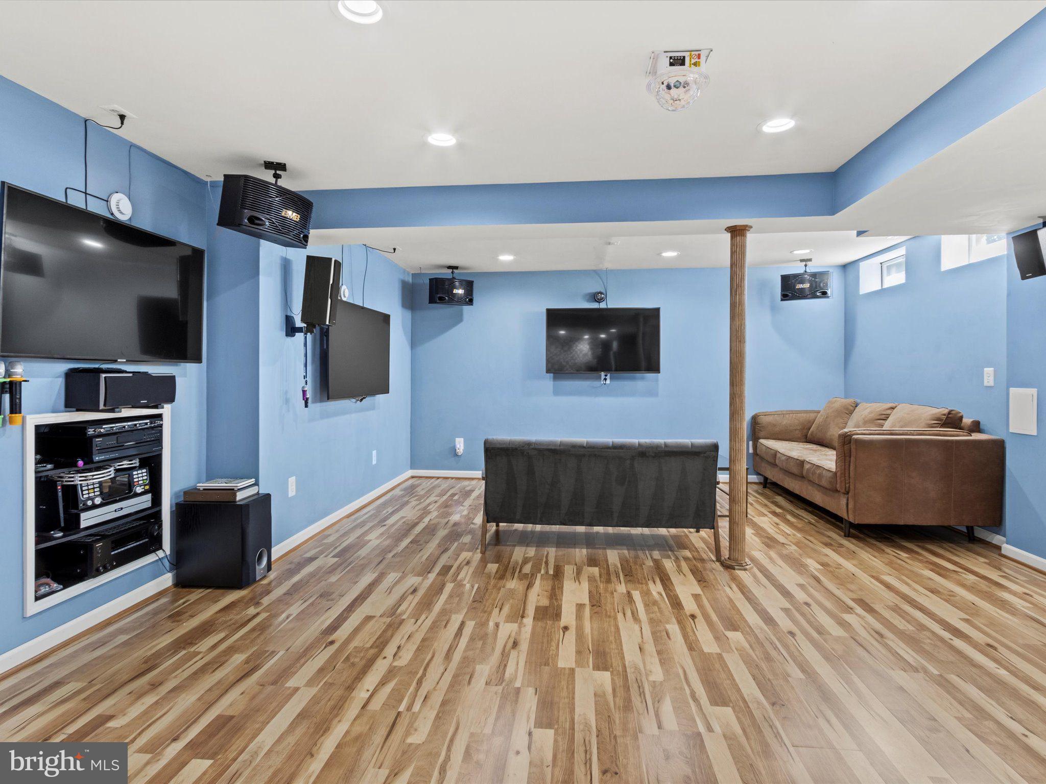 1505 Ridge Forest Way Hanover, MD 21076 - Photo 29 of 40 a living room with furniture and a flat screen tv
