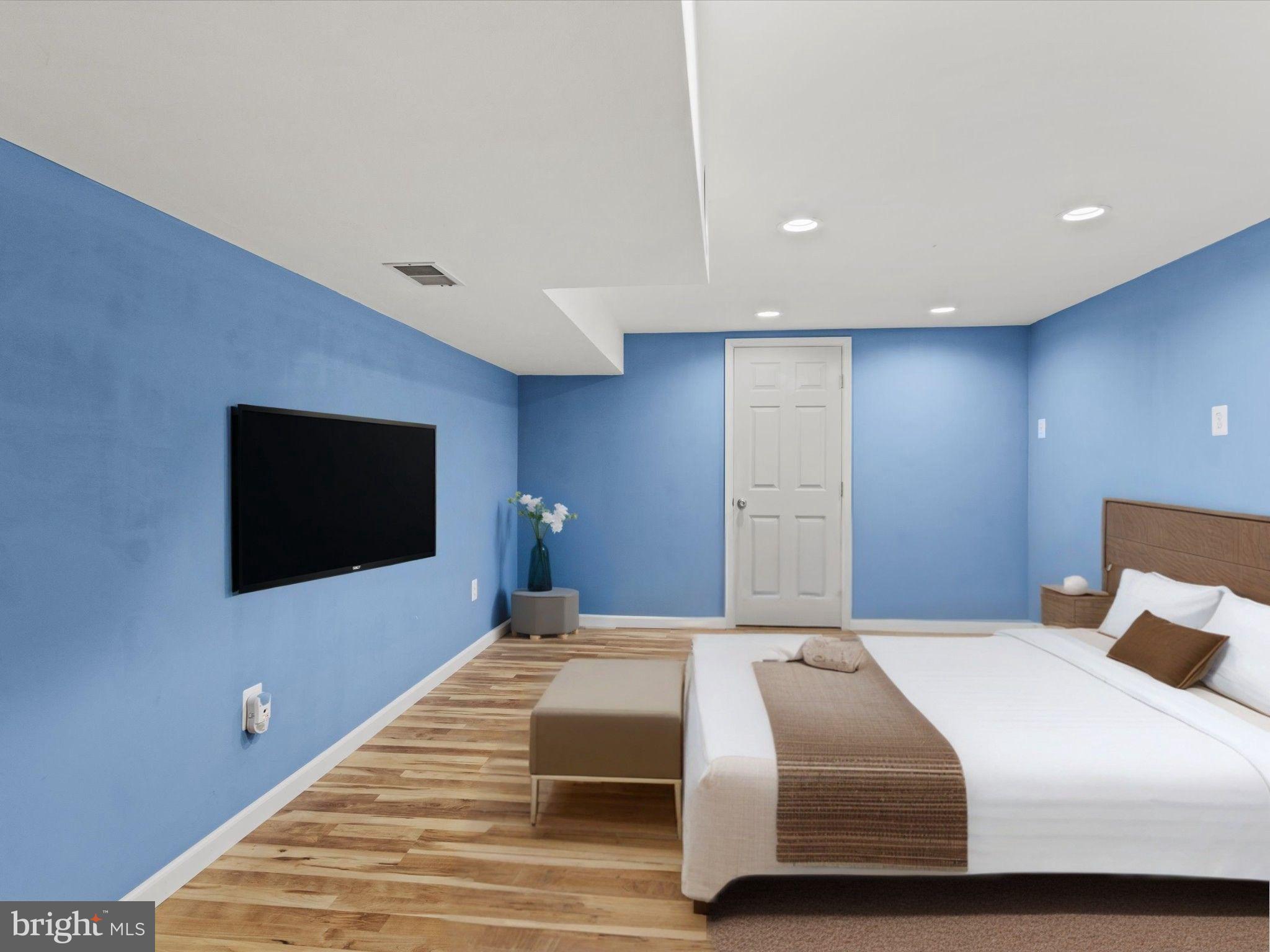1505 Ridge Forest Way Hanover, MD 21076 - Photo 30 of 40 a bedroom with a bed and a flat screen tv