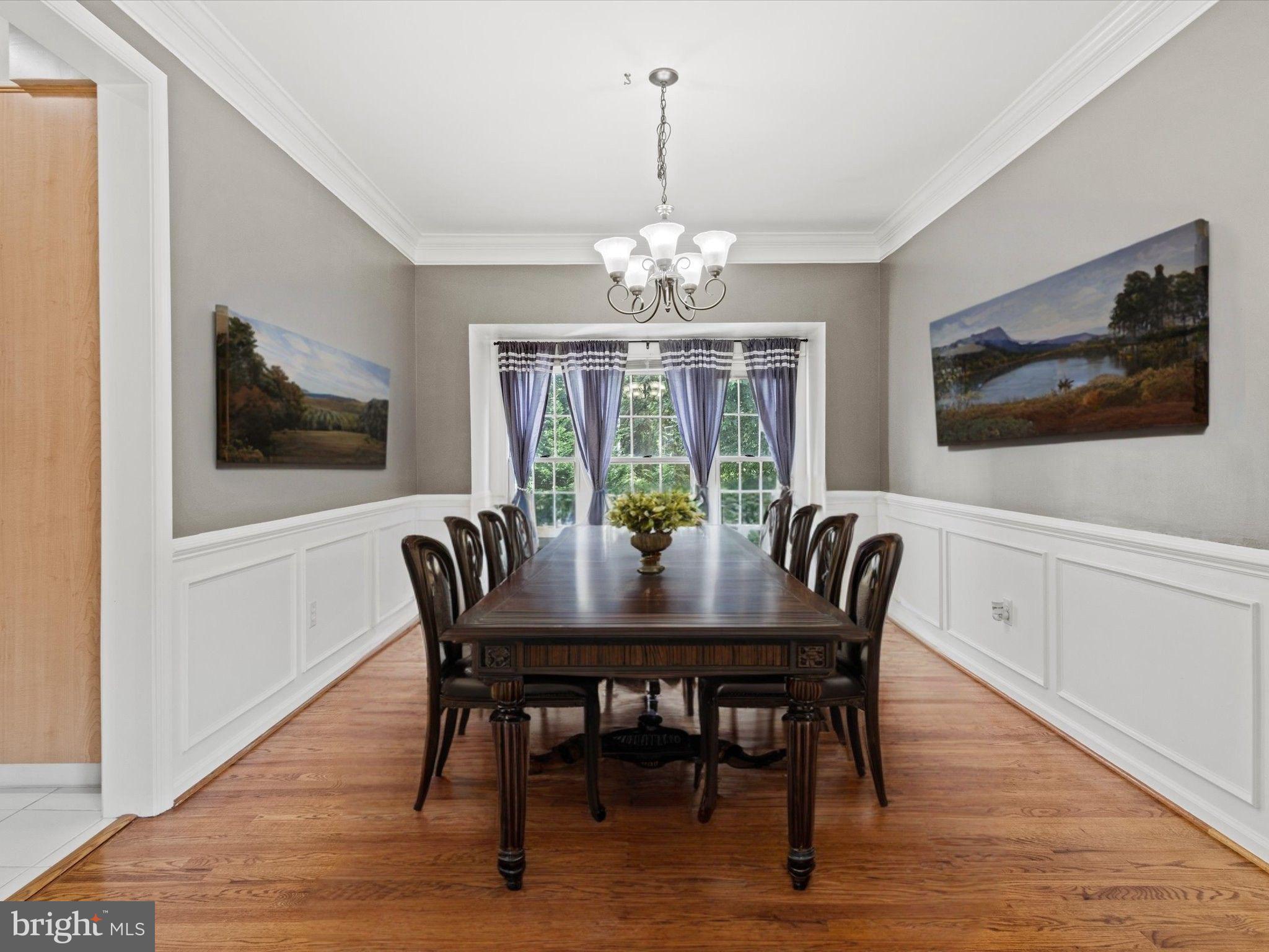 1505 Ridge Forest Way Hanover, MD 21076 - Photo 5 of 40 a view of a dining room with furniture window and wooden floor