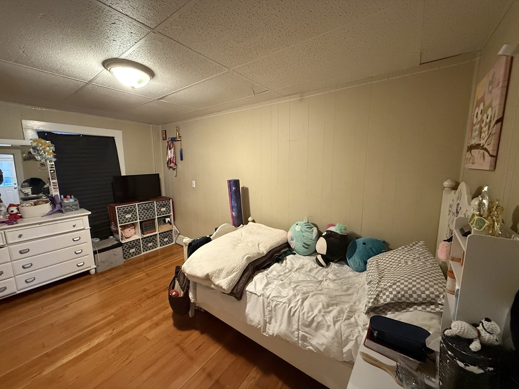 110 River Street Hudson, MA 01749 - Photo 11 of 15 a bedroom with a bed and furniture