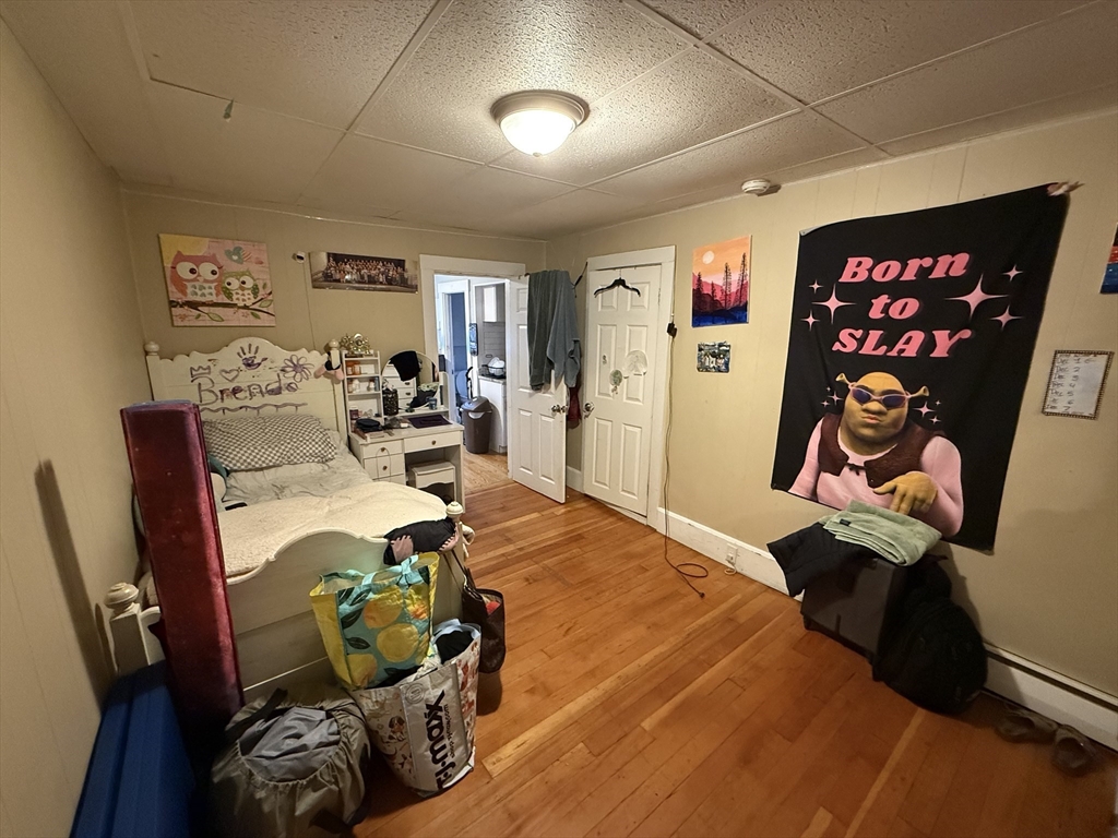 110 River Street Hudson, MA 01749 - Photo 12 of 15 a living room with furniture and a flat screen tv