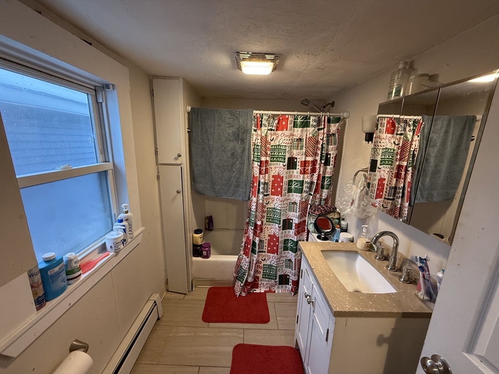 110 River Street Hudson, MA 01749 - Photo 13 of 15 a bathroom with a sink and a mirror