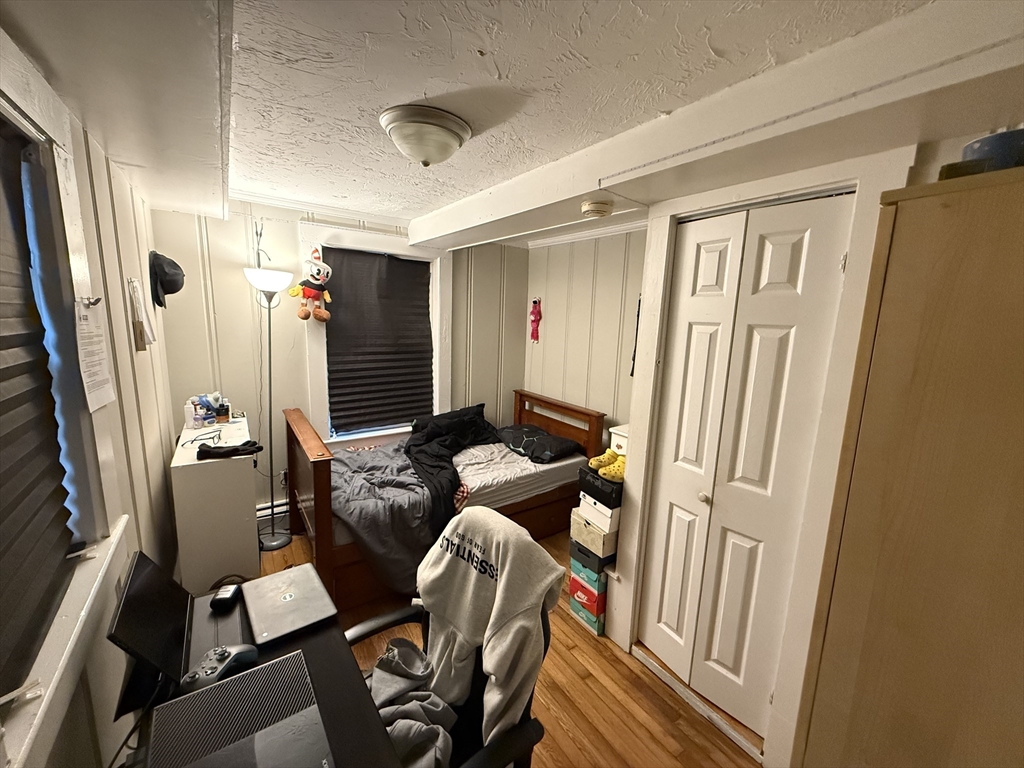 110 River Street Hudson, MA 01749 - Photo 14 of 15 a living room with furniture and a flat screen tv