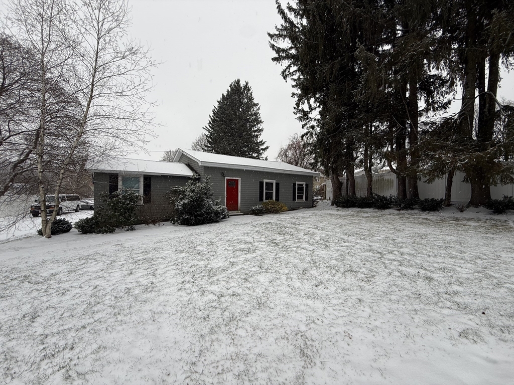 110 River Street Hudson, MA 01749 - Photo 15 of 15 a front view of house with a garden