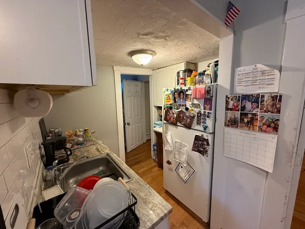 a kitchen with a sink appliances and cabinets