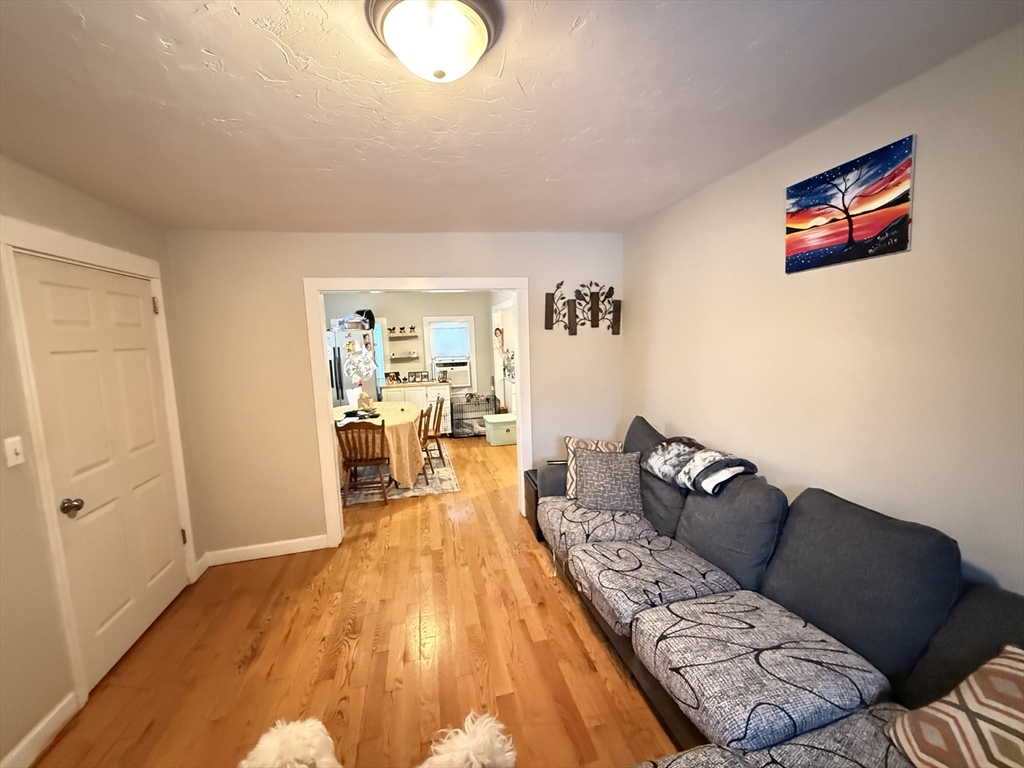 110 River Street Hudson, MA 01749 - Photo 7 of 15 a living room with furniture and a wooden floor