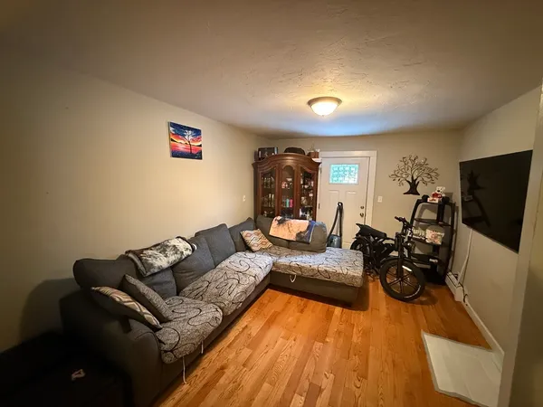 a bed room with a bed and a television