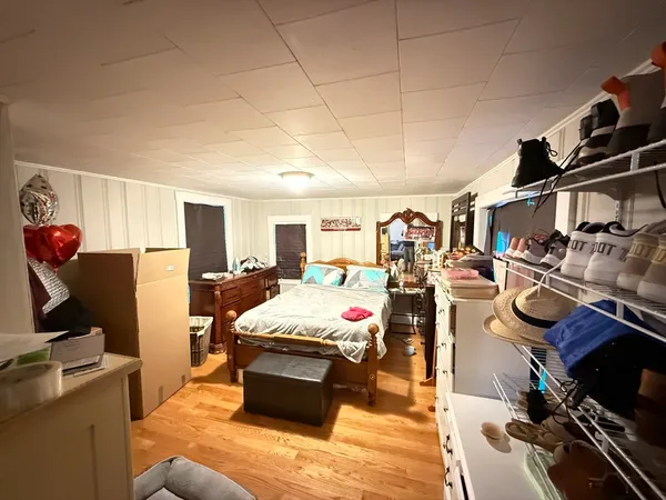 a bedroom with a bed and furniture