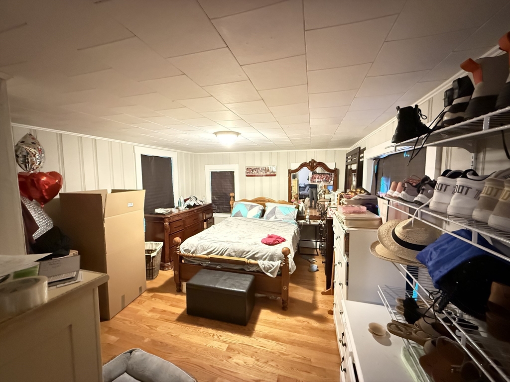 110 River Street Hudson, MA 01749 - Photo 9 of 15 a bed room with a bed and a desk