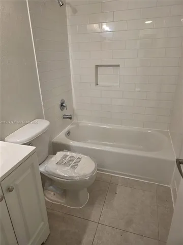 a bathroom with a sink a toilet and a bathtub